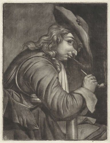 Jonge pijprokende man met een hoed