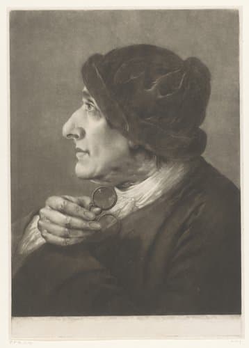 Man met een bril in zijn hand