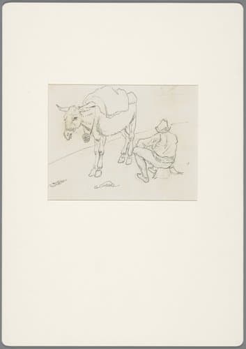 Zittende man bij een ezel