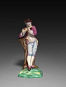 Boy Playing a Flute by Saint-Amand-les-Eaux (French)