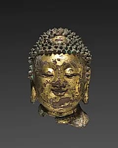 Head of Buddha by Unknown Artist
