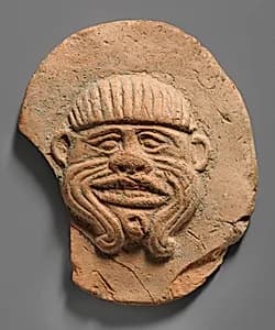 Plaque with face of the demon Humbaba by Unknown Artist