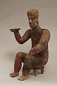 Female Figure Seated on Stool by Unknown Artist