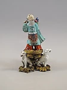 Figure of God of Longevity (Shoulao) and two dogs by Unknown Artist