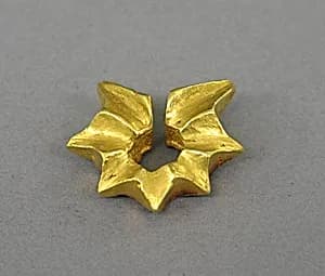 Ear Clip in the Shape of a Starfruit by Unknown Artist