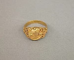 Ring with Oval Bezel and Raised Design of Fish by Unknown Artist