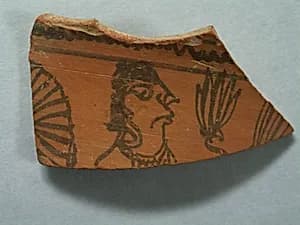 Shard: Head of Offerer with Plant by Unknown Artist