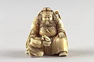 Netsuke of Shoki Holding a Demon by a Cord by Unknown Artist