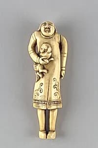 Netsuke of Foreigner Carrying a Dog by Unknown Artist
