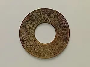 Annular Disk with Carved Designs by Unknown Artist