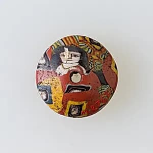 Bead with face canes by Unknown Artist
