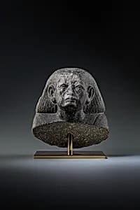 Head and shoulders of a male statue by Unknown Artist
