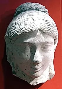 Mask of a woman with an austere hairstyle by Unknown Artist