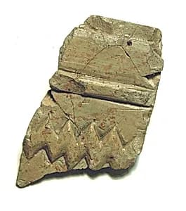 Raised relief fragment by Unknown Artist