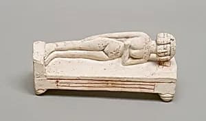 Reclining female figure on a bed by Unknown Artist