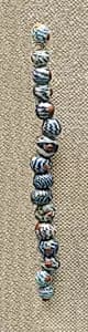 String of 16 Beads by Unknown Artist