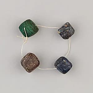String of 4 beads by Unknown Artist