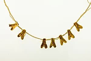 String of 7 fly amulets by Unknown Artist