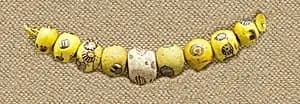 String of 9 Eyed Beads by Unknown Artist