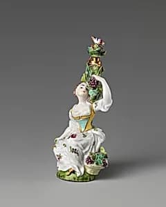 Lady seated amongst a grapevine