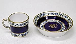 Miniature cup and saucer by Sèvres Manufactory