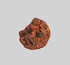 Amber disk with a nereid riding a triton by Unknown Artist