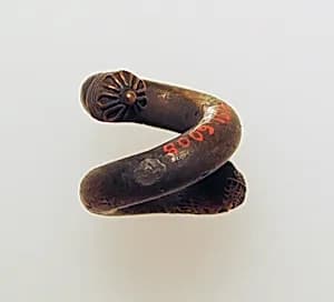 Earring, spiral with lion's head by Unknown Artist