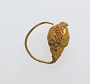 Earring with head of woman by Unknown Artist