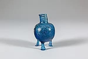 Glass bottle with three feet by Unknown Artist
