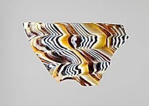 Glass mosaic ribbed bowl fragment by Unknown Artist
