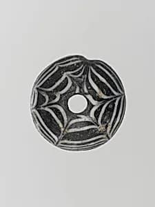 Glass spindle whorl by Unknown Artist