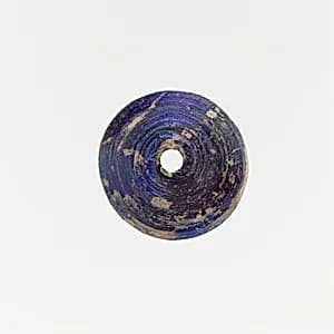 Glass spindle whorl by Unknown Artist