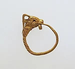 Gold earring with head of a goat by Unknown Artist