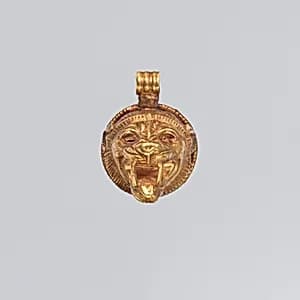 Gold lion-head pendant by Unknown Artist