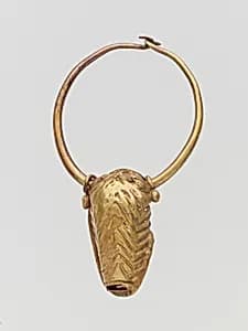 Gold pendant in the form of a bull's head by Unknown Artist