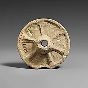Limestone chariot wheel by Unknown Artist