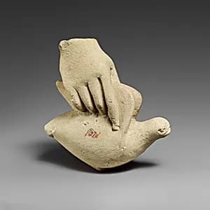 Limestone hand holding a dove by Unknown Artist