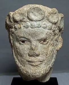 Limestone head of a bearded man by Unknown Artist