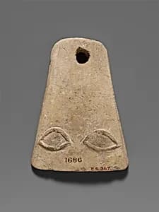Limestone plaque with two eyes in relief by Unknown Artist