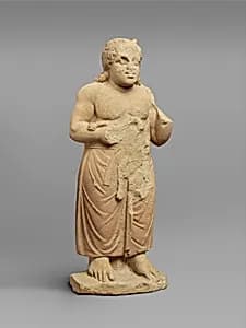 Limestone statue of a god by Unknown Artist