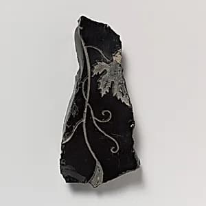 Obsidian revetment slab fragment by Unknown Artist