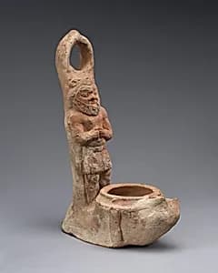 Terracotta lamp representing Bes by Unknown Artist