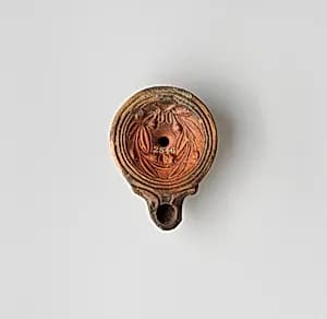 Terracotta oil lamp by Unknown Artist