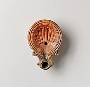 Terracotta oil lamp by Unknown Artist