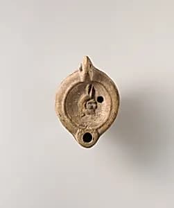 Terracotta oil lamp by Unknown Artist