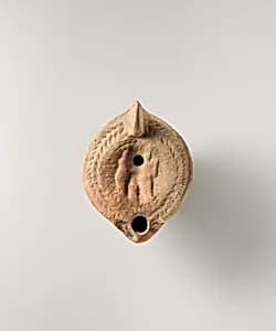Terracotta oil lamp by Unknown Artist