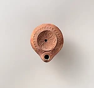 Terracotta oil lamp by Unknown Artist