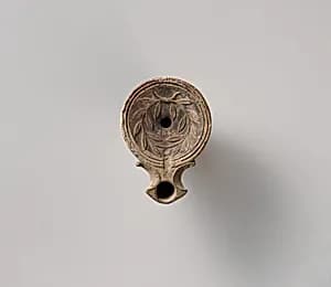 Terracotta oil lamp by Unknown Artist