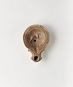 Terracotta oil lamp by Unknown Artist