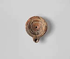 Terracotta oil lamp by Unknown Artist